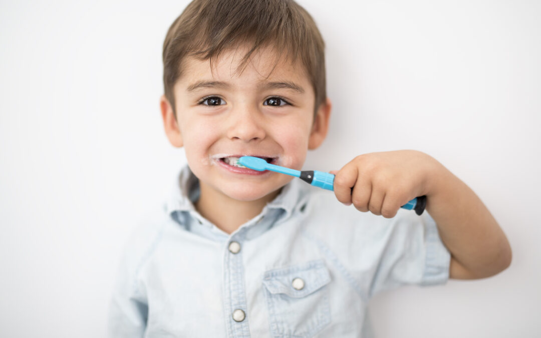 Young boy brushing his teeth